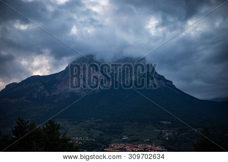 Mountain Peak Hidden By Cloudy Sky On Evening