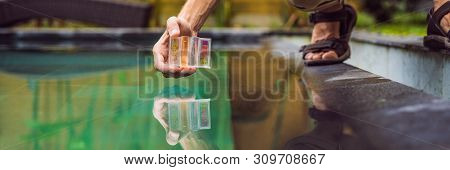 Pool Worker Checks The Pool For Safety. Measurement Of Chlorine And Ph Of A Pool Banner, Long Format