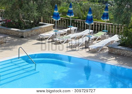 Gargano, Italy - June 6, 2017: Generic Hotel Pool At Gargano Peninsula. Italy Is One Of Most Visited