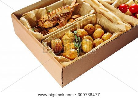 Delicious Fried Meal Carton Box Isolated Delivery. Roasted Potato And Grill Chicken Meat, Tomato Che