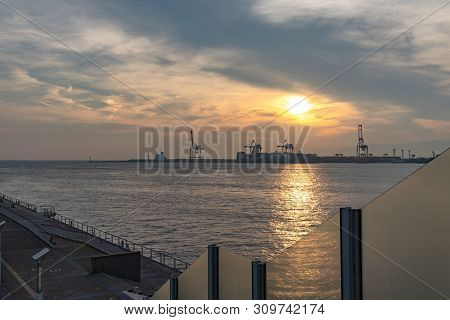 Osaka Bay With Yumeshima Island On Background In Summer Sun Set Time, View From Osaka Metro Cosmosqu