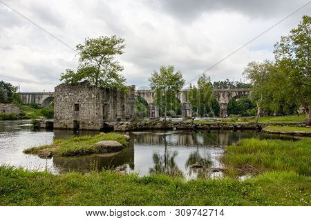 Amares, Portugal - June 20, 2019 : Ruins Of A Mill On The Green Banks Of The River Cávado In Braga, 