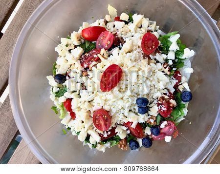 Authentic Turkish Goat's Milk Tulum Cheese Salad With Cherry Tomatoes, Blueberry And Walnut.