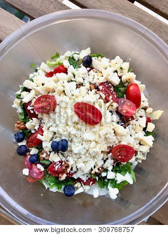 Authentic Turkish Goat's Milk Tulum Cheese Salad With Cherry Tomatoes, Blueberry And Walnut.