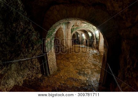 The Tunnel Cut Through The Rock. Cenote Ecoturistico X-cajum With Blue Clear Water. Mexico, Yucatan.