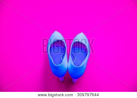 Blue High Heeled Shoes On Pink Purple Background - Top View - Heels Pointing Up