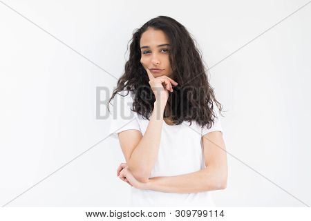 Close Up Portrait Of Charming And Lovely Young Woman Looks Away Keep Her Hand On The Chin Isolated O