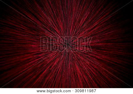 Natural Lens Zoom Explosion Radial Blurred Red Particles On Black Background With Selective Focus
