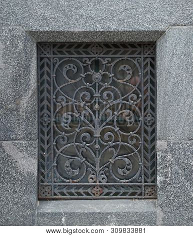 The Basement Window With A Metal Barrier