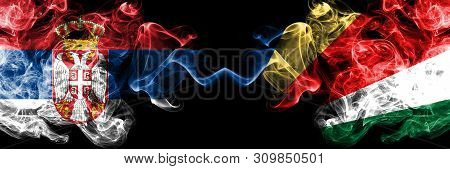 Serbia Vs Seychelles, Seychelloise Smoky Mystic Flags Placed Side By Side. Thick Colored Silky Smoke