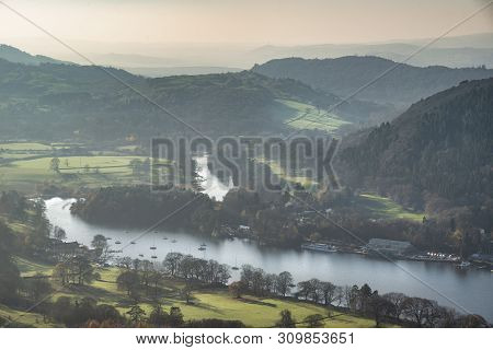 Beautiful Autumn Fall Landscape Image Of View From Gummers How Down Onto Derwent Wter In Lake Distri