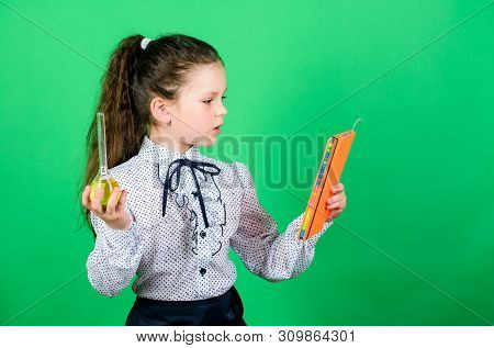 Documenting The Result Of Experiments. Small Smart Girl With Testing Flask. Child Study Bilogy Lesso