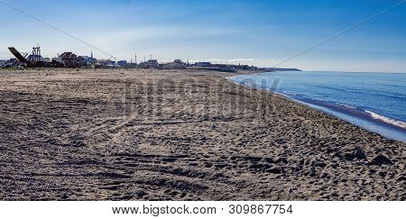 A Panoramic Look Of The Dark Sand Beach Of Nome Were A Major Gold Rush Occurred Around 1900.