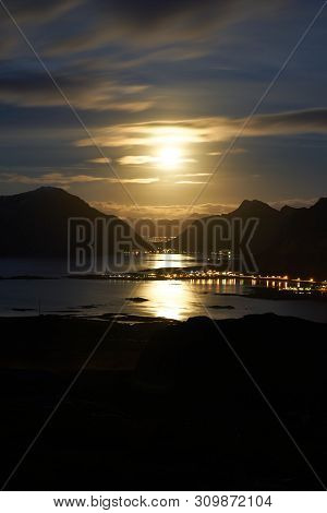 Lofoten Landscape During Night With The Rising Moon Near Fredvang.