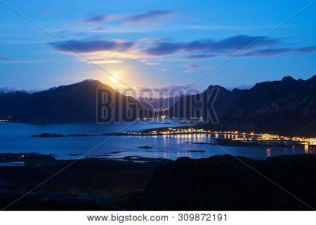 Lofoten Landscape During Night With The Rising Moon Near Fredvang.