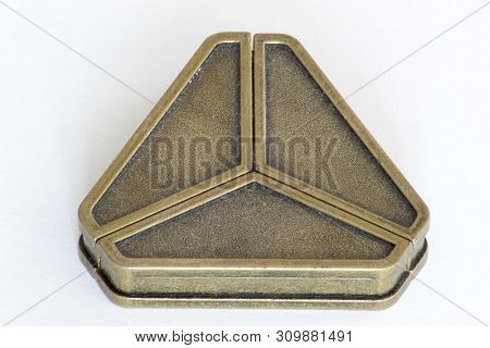 Cast Iron Puzzle In The Shape Of A Triangle