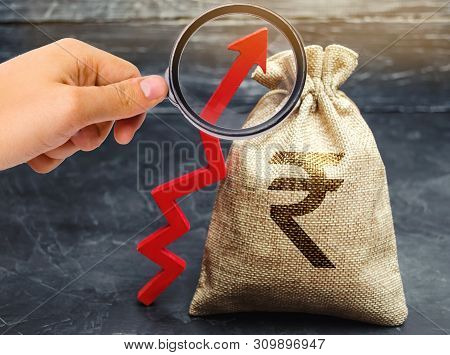 Money Bag With Indian Rupee (rupiah) And Arrow Up. The Concept Of Profit Growth And Income. Successf
