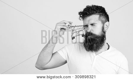 Stressed Customer Man Having Collision With Shopping Cart. Sale, Discount And Online Shopping Concep