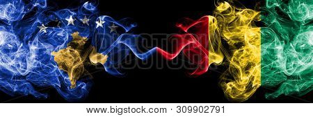 Kosovo Vs Guinea, Guinean Smoky Mystic Flags Placed Side By Side. Thick Colored Silky Smokes Combina