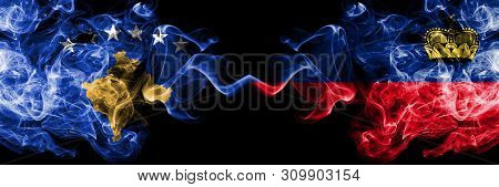 Kosovo Vs Liechtenstein, Liechtensteins Smoky Mystic Flags Placed Side By Side. Thick Colored Silky 