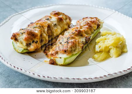 Baked Zucchini Courgettes Stuffed With Cheese And Dill.