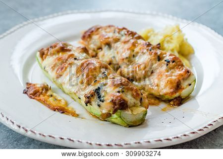 Baked Zucchini Courgettes Stuffed With Cheese And Dill.