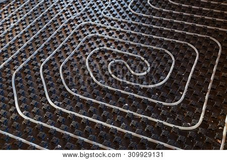 Black Underfloor Heating Surface With Heating Pipes