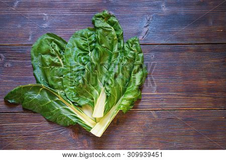 Balkan Cuisine. Blitva ( Chard Leaves ) - Popular Leafy Vegetables. Dark Rustic Background, Flat Lay