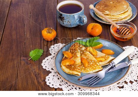 Wheat Pancakes With Honey And Apricots. Photo