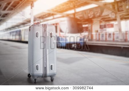 Sillver Suitcases Or Baggage At Blurred Of Sky Train Station Platform. Trip Vacation Or Holiday Tour
