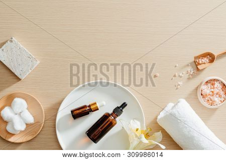 Spa Still Life Top View With Flowers, Natural Oil, Bath Salth And Towels, Spa Skincare Products,pumi