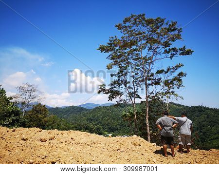 A Surveyor Is Measuring The Length Of The Highland In Penampang, Kota Kinabalu. Sabah, Malaysia. Bor