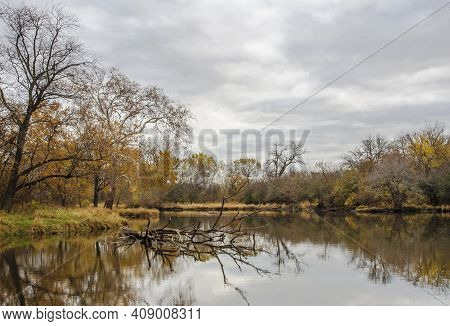 A Storm Clearing Gray Sky Hangs Over The Dupage River At Hammel Woods Forest Preserve In Will County