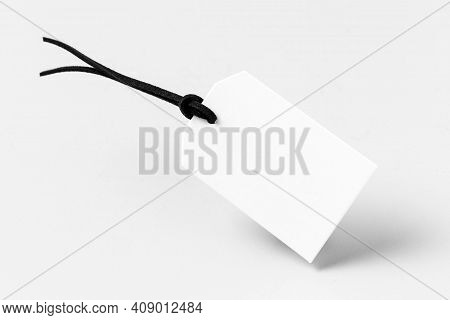 White Empty Label On Black Cloth Background