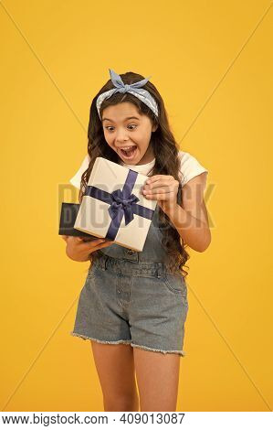 Surprised Kid On Yellow Background. Birthday Surprise For Her. Bargain Sale Concept. Black Friday Di
