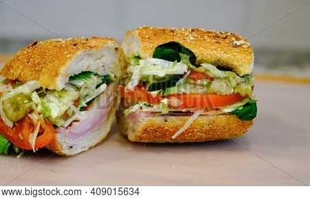 Ham And Turkey Sub Sandwich On Cutting Board