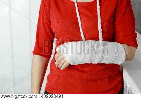 A Broken Arm. Close-up Of The Plaster. A Lady In A Red Jacket With A Bright Manicure. Exercises To R