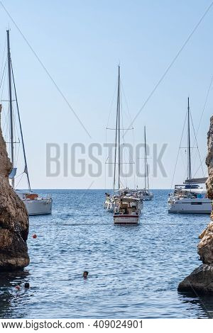 Vis, Croatia - Aug 17, 2020: People Swim At The Inlet Of Sheltered Stiniva Beach Shore In Summer
