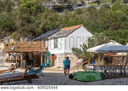 Vis, Croatia - Aug 17, 2020: The Only Restaurant In Stiniva Shlerted Cove Beach In Summer
