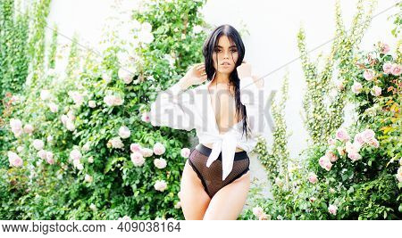 Spring Sunny Portrait. Sexy Spring Woman In Rose Garden. Sensual Girl Outdoors. Natural Beauty. Spri