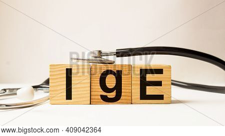 Word Ige On Wooden Blocks. Medical Concept . The Medicine