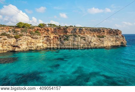 Clear Blue Green Sea Water, Rocky Cliffs Around - Nice Sunny Day At Ansa De Sestri, Mallorca