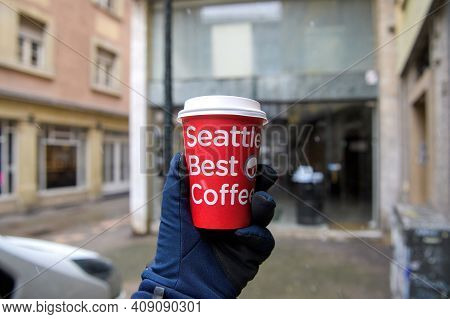Strasbourg, France - Jan 14, 2021: Pov Male Hand Wearing Winter Glove Personal Perspective Holding P