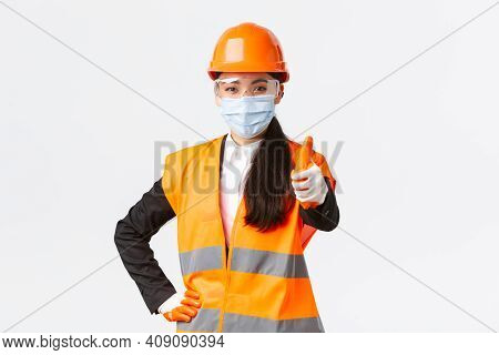 Covid-19 Safety Protocol At Enterpise, Construction And Preventing Virus Concept. Confident Asian Fe