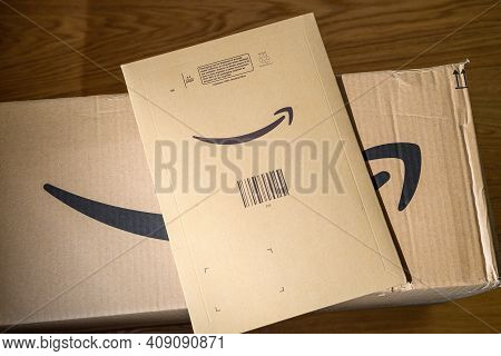 Paris, France - Feb 6, 2021: Two Amazon Prime Cardboard Parcels One Large Box And One Envelope With 