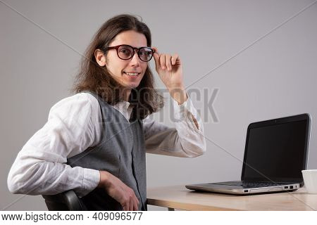 Programming And Application Development, A Young Man Writes Code Sitting At A Laptop.