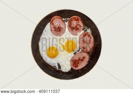 Fried Chicken Eggs With Sausage In A Frying Pan Top View.homemade Fried Eggs With Sausage In A Fryin