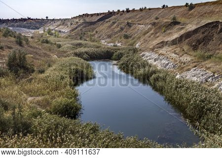 A Slope Of A Non-working Side Of A Clay Pit With Traces Of Erosion And Suffusion. Zarozhye Region, U