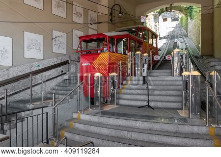 Upper City Funicular Line In Bergamo (funicolare Citta Alta). Red Funicular Connects Old Upper City 