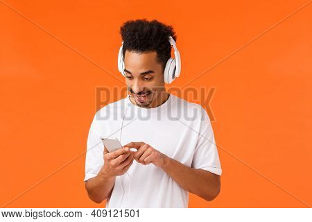 Guy Searching Right Track Boost Mood. Joyful Attractive African-american Man In White T-shirt, Put O
